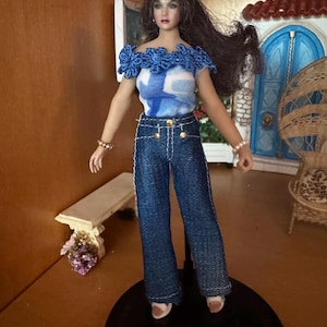 1/12 scale Tbleague doll outfit includes tight fitting wide leg Jean, long and short sleeved top, jewelry and sandals.