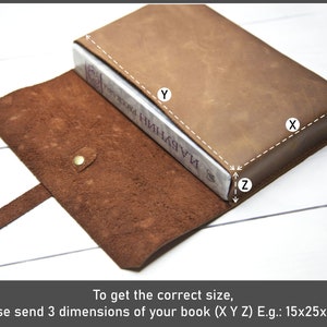May include: Brown leather book cover with a strap. To get the correct size, please send 3 dimensions of your book (X Y Z) E.g.: 15x25x4 cm