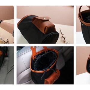 Op de afbeelding: Zwarte canvas auto-organizer met een bruin leren handvat en een klein bruin leren zakje. De organizer heeft een trekkoord sluiting en kan aan een hoofdsteun worden gehangen.