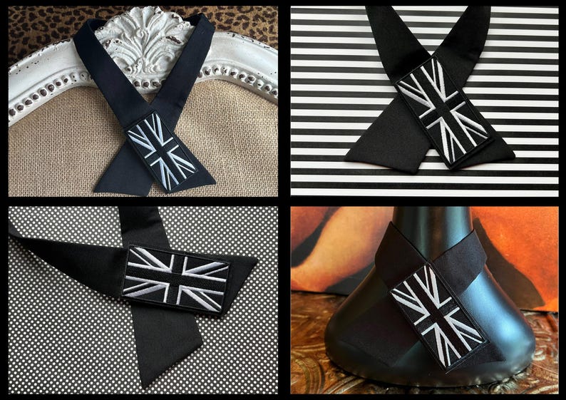 K&ouml;nnte beinhalten: Schwarze Krawatte mit Union Jack-Aufn&auml;her. Die Krawatte ist aus dunklem Stoff gefertigt und hat einen rechteckigen Aufn&auml;her mit der britischen Flagge in Wei&szlig; und Schwarz. Die Krawatte wird in verschiedenen Umgebungen gezeigt.