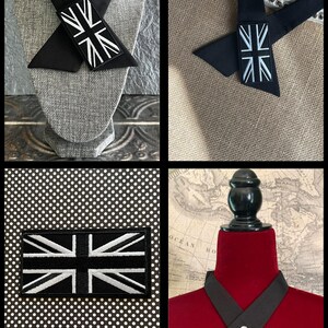 K&ouml;nnte beinhalten: Eine Auswahl an schwarzen Accessoires mit der Union Jack-Flagge. Dazu geh&ouml;ren ein schwarzer Kragen mit Union Jack-Aufn&auml;her, eine schwarze Krawatte mit Union Jack-Aufn&auml;her und ein Union Jack-Aufn&auml;her auf gepunktetem Hintergrund.