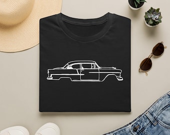 May include: A black t-shirt featuring a white line art illustration of a classic vintage car on the front. The design depicts the side profile of the vehicle with clean, minimalist outlines, showcasing the iconic body shape of a mid-century automobile.