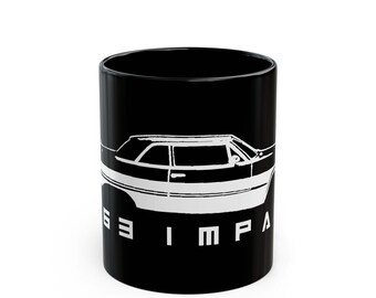 May include: Black ceramic mug featuring a white graphic of a classic car. The car's silhouette is prominently displayed, with the word "63 IMPALA" printed vertically in white. The mug has a glossy finish and a cylindrical shape.