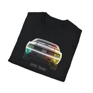 May include: Black t-shirt featuring a colorful graphic of a 1970 'Cuda muscle car. The car's rear is depicted with a gradient of colors, including yellow, green, and blue. The text "1970 'Cuda" is printed below the car.