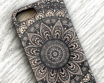 May include: A black and gold phone case with a detailed mandala design.