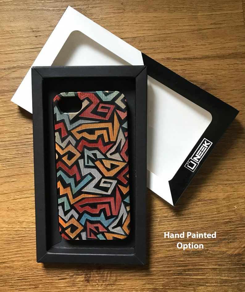 May include: A black phone case with a colorful geometric pattern. The case is in a black box with a white interior. The text "Hand Painted Option" is visible below the box.
