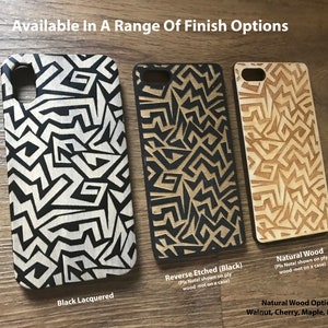 May include: Three phone cases with a geometric pattern. The cases are made of wood and are available in black lacquered, reverse etched black, and natural wood finishes. The natural wood options are walnut, cherry, maple, and bamboo.
