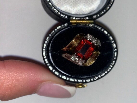Spessarttite garnet and diamond ring