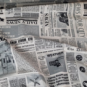 Dekostoff "Newspaper" schwarz-dunkelbeige, Leinenoptik Stoffmischung, grafisches Muster, Zeitung-Muster