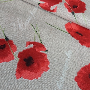 May include: Red poppy flower print fabric with a beige background. The fabric has a subtle texture and the flowers are scattered throughout the fabric.