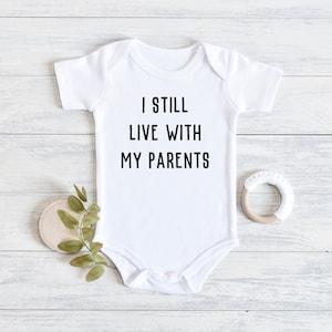 I Still Live With My Parents Onesie® - Funny Baby Onesie® - New Parent Gift - Cute Baby Onesie®
