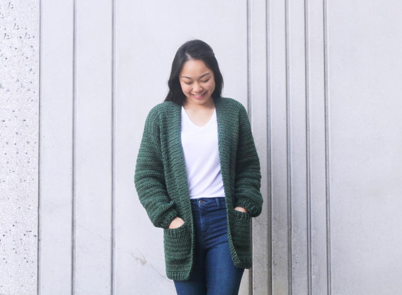 oversized slouchy crochet cardigan with woman's hands in pockets