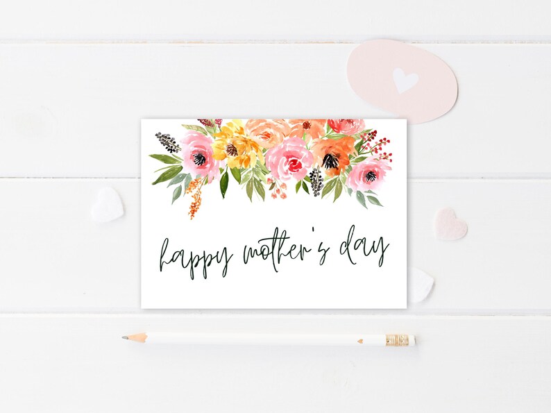 May include: A white card with a watercolor floral design in shades of pink, orange, and yellow. The text "happy mother's day" is written in black cursive.