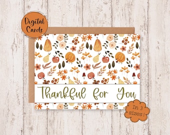 May include: A digital printable card with a white background and a pattern of fall-themed illustrations. The illustrations include pumpkins, pears, leaves, and flowers in shades of orange, yellow, brown, and green. The text "Thankful for You" is written in a brown cursive font at the bottom of the card.