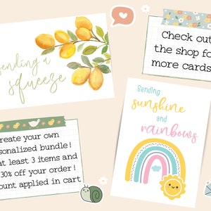 May include: A collection of greeting cards with cheerful designs. One card features lemons and the phrase "sending a squeeze." Another card displays a rainbow and sun with the text "sending sunshine and rainbows." The image also includes the text "Check out the shop for more cards!"