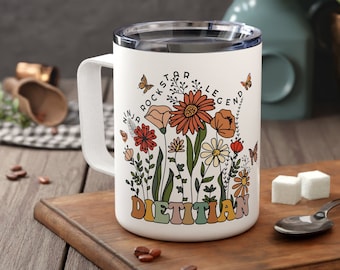 May include: White ceramic mug with a floral design and the text "Rockstar Legend Dietitian".