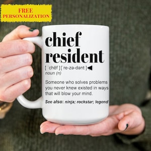 May include: White ceramic mug with a black design that reads "chief resident" and defines the word as "someone who solves problems you never knew existed in ways that will blow your mind." The mug also lists "ninja, rockstar, legend" as related terms.