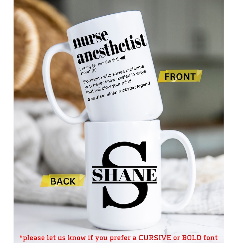May include: White ceramic mug with a black design. The front of the mug says "nurse anesthetist" with a definition. The back of the mug has a black letter "S" with the name "SHANE" inside the letter.