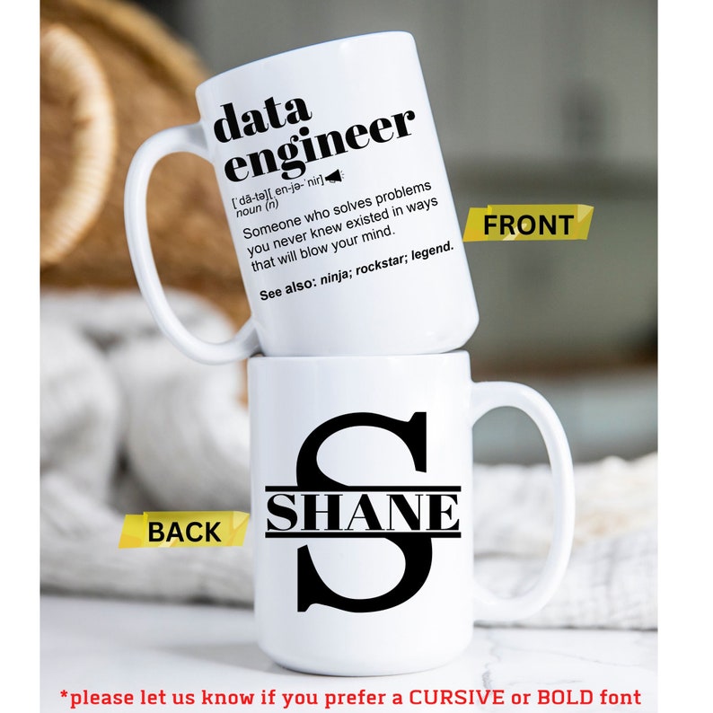 May include: Two white ceramic mugs stacked. The top mug features the text "data engineer" with a definition. The bottom mug displays the name "SHANE" with a large initial "S". The front and back of the mugs are labeled. The bottom of the image has text about font preference.