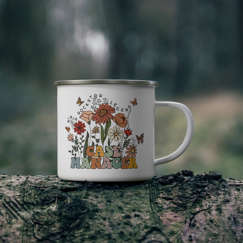 May include: White enamel camping mug with a floral design and the text "Ninja Rockstar Legend Case Manager".