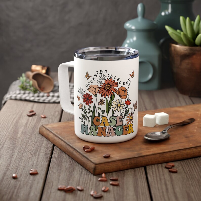 May include: White ceramic mug with a floral design and the text "Rockstar Legend Case Manager".