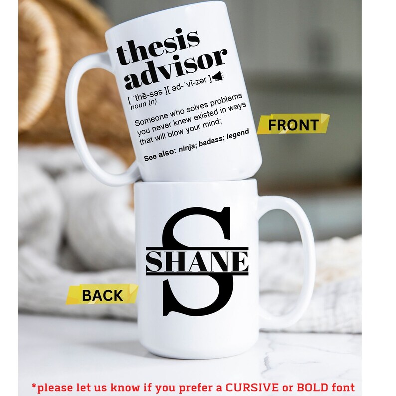 May include: Two white ceramic mugs stacked. The front mug has the text "thesis advisor" with a definition. The back mug features the name "SHANE" in a black font. The front of the mug has a yellow label that says "FRONT", and the back has a yellow label that says "BACK".