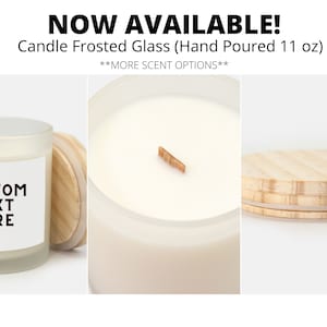 May include: A frosted glass candle with a wooden lid and a white label that says "CUSTOM TEXT HERE". The candle is hand-poured and is 11 ounces.