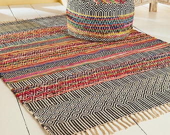 Colourful and hard wearing chindi cotton and jute oval rug for home  interior use available in four sizes