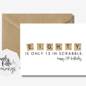 May include: A white greeting card with the text "EIGHTY IS ONLY 13 IN SCRABBLE. happy 13th birthday" in black. The word "EIGHTY" is spelled out using Scrabble tiles. A brown envelope is behind the card.