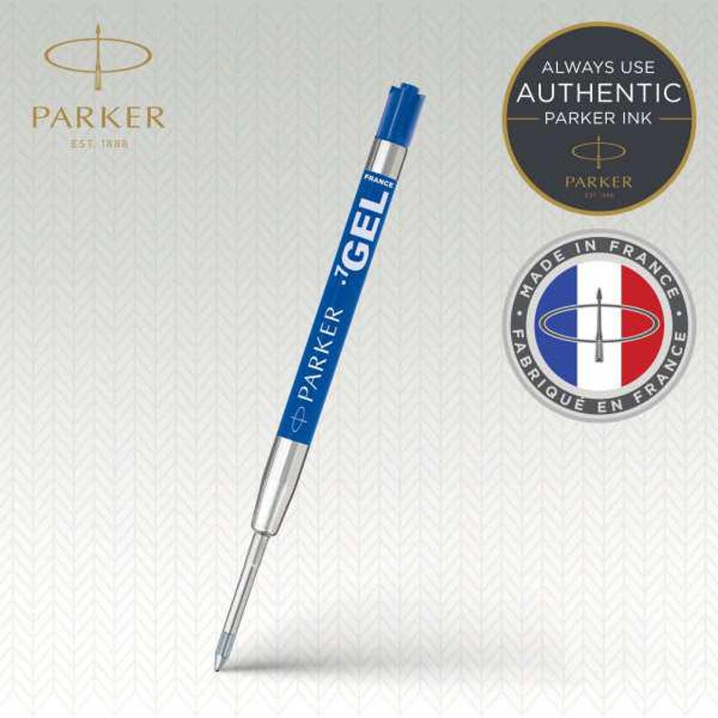 May include: A blue and silver Parker gel ink pen refill featuring the text Parker Gel and France printed on the side. The refill includes a blue cap at the top and a metal tip at the bottom, accompanied by circular logos indicating authentic ink.