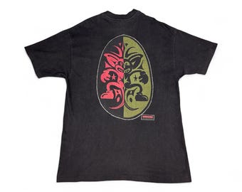 Camiseta gráfica vintage de los 90 con diseño de monstruo, estilo streetwear