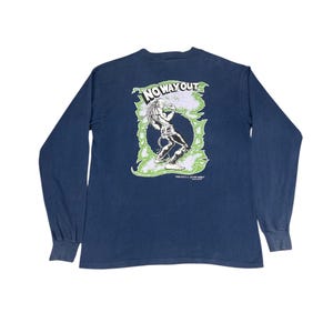 May include: Navy blue long-sleeve shirt with a graphic on the back that says "NO WAY OUT". The graphic features a figure in a green and white design. The shirt has ribbed cuffs.