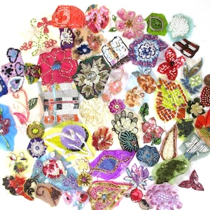 May include: Assortment of colorful beaded and sequined fabric embellishments, perfect for adding a touch of sparkle to clothing, accessories, or home decor projects.
