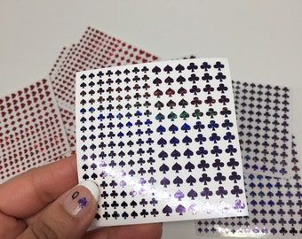 Nail glitters playing cards suits.