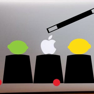 The cups and balls Magic Macbook vinyl decal.