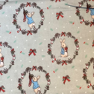 Fabric winter time Peter Rabbit light green