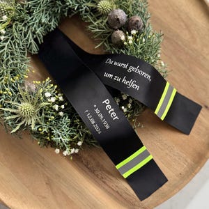 Brandkårens sorgband med reflex: Värdigt minne för brandmän
