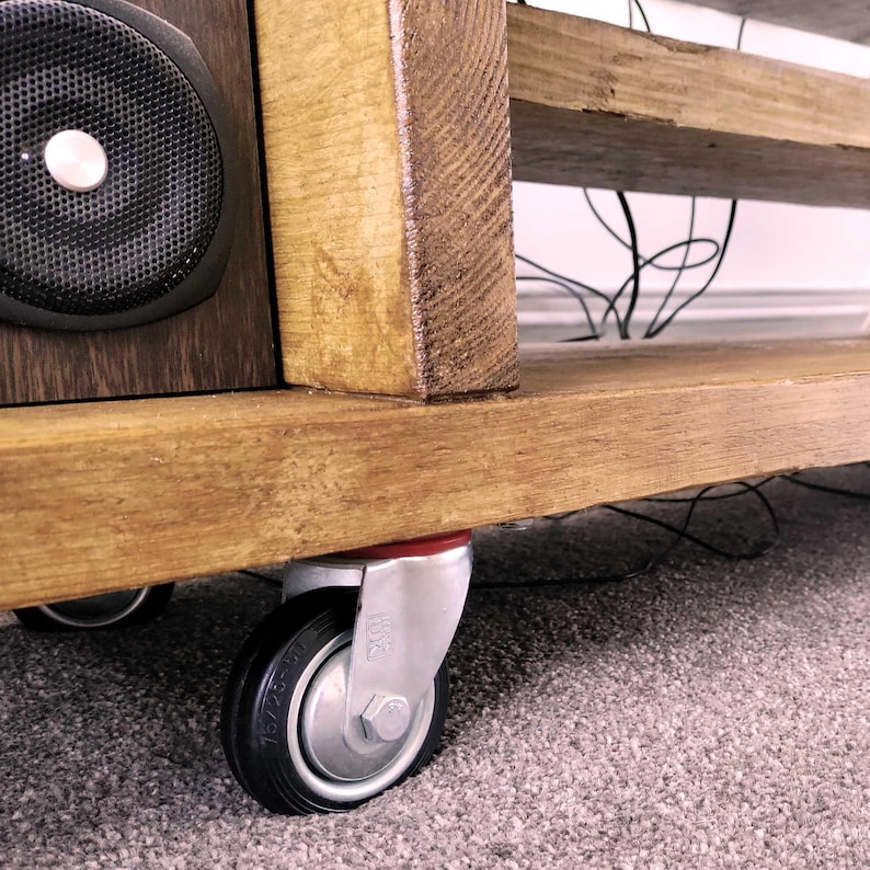 Detailed image of the Castor Wheels of the Wooden Tv Cabinet