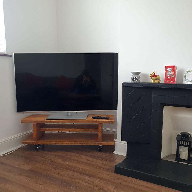 Customer image of the small size rustic tv stand