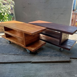 2 Mobile Media Consoles shown in a natural oak stain and a dark oak stain