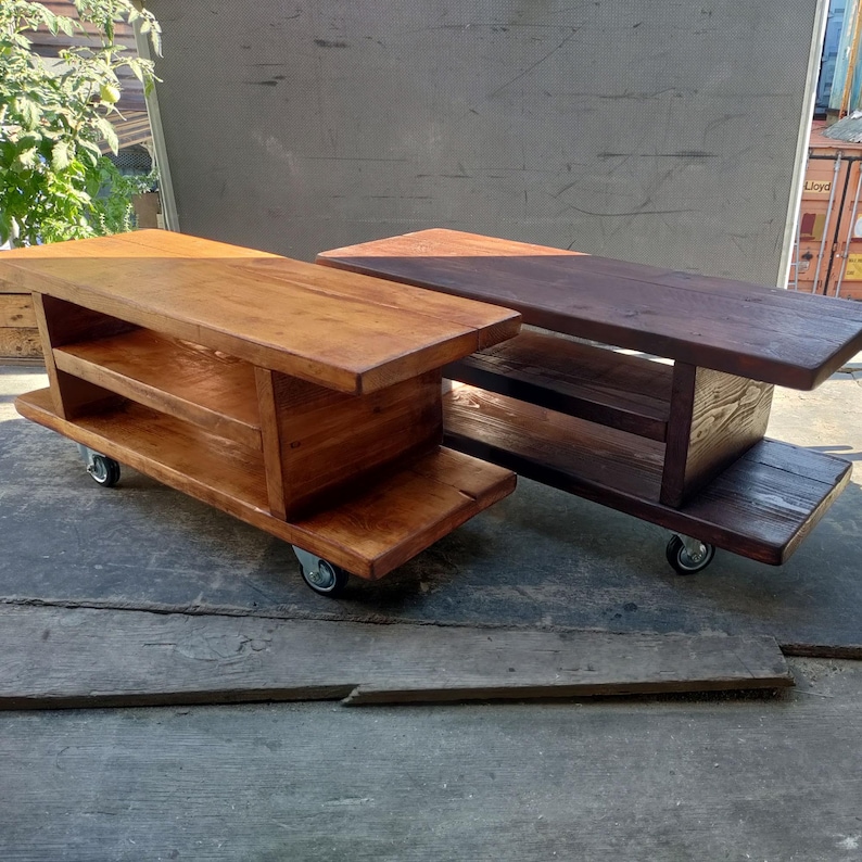 2 Mobile Media Consoles shown in a natural oak stain and a dark oak stain