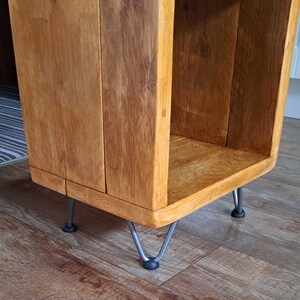 detailed shot showing raw steel 10cm hair pin legs on a 3 tier storage unit stained in Natural Oak satin wood stain