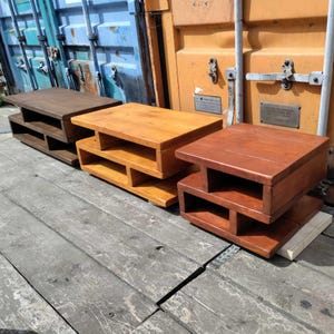 Image showing all three sizes of the coffee table available. From the left the large table is stained in Dark Oak, the medium table in Natural Oak and the small table in a Teak stain. Photographed outside my workshop under natural lighting.