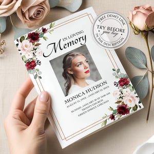 May include: A memorial card with the text "In Loving Memory" and a photo of a woman. The card is decorated with floral arrangements in shades of burgundy and pink. The card includes the name "Monica Hudson" and dates.