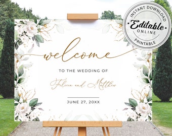 May include: White wedding welcome sign with green and gold floral accents. The sign says "Welcome to the wedding of Felicia and Matthew June 27, 20XX".