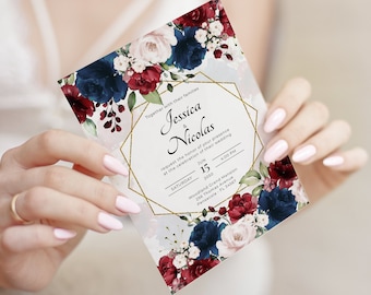 May include: Wedding invitation with a gold geometric frame and floral design. The invitation features a watercolor floral design with burgundy and navy blue flowers. The text reads "Together with their families Jessica & Nicolas request the honor of your presence at the celebration of their wedding Saturday June 15 2050 4:00 PM Woodland Grand Mansion 256 Thomas Avenue Pensacola FL 34567"