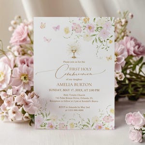 May include: A First Holy Communion invitation card with floral and butterfly accents. The card features the text "First Holy Communion" and details for Amelia Burton's event, including the date, time, and location. Soft pink and yellow flowers and butterflies decorate the edges.