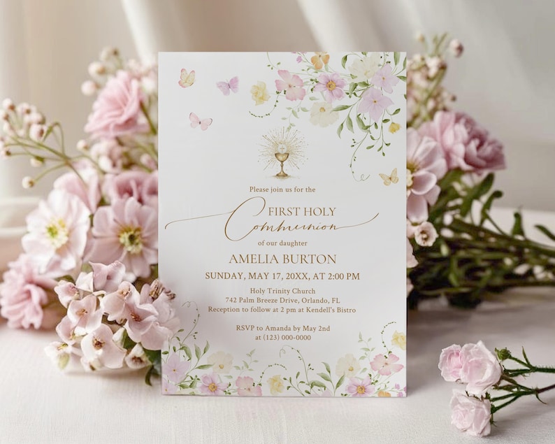 May include: A First Holy Communion invitation card with floral and butterfly accents. The card features the text "First Holy Communion" and details for Amelia Burton's event, including the date, time, and location. Soft pink and yellow flowers and butterflies decorate the edges.