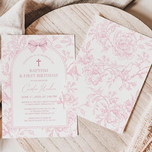 May include: Two baptism and first birthday invitations. The invitation on the left has a pink floral design with text that reads "Baptism & First Birthday". The invitation on the right has a pink floral pattern.