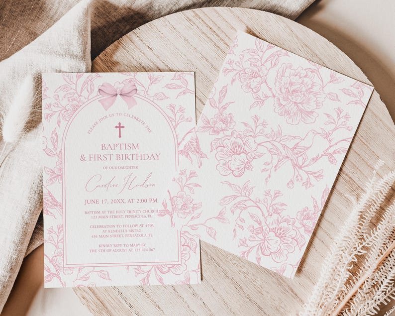 May include: Two baptism and first birthday invitations. The invitation on the left has a pink floral design with text that reads "Baptism & First Birthday". The invitation on the right has a pink floral pattern.